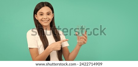 stay hydrated. kid hold glass of mineral water. child feel thirsty. Banner of child girl with glass of water, studio portrait with copy space. Royalty-Free Stock Photo #2422714909