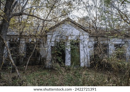 Old shop in Illinci abandoned village in Chernobyl Exclusion Zone in Ukraine Royalty-Free Stock Photo #2422721391