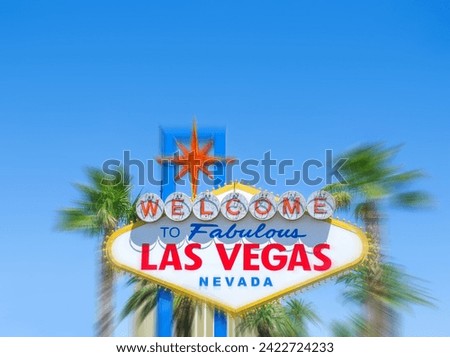 Famous Las Vegas sign on bright sunny day with blue sky background, copy space and motion blur effect