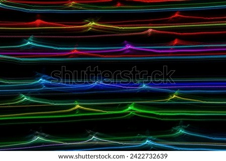 Colorful fractal lights lines on black background. Long exposure photography
