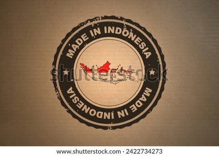 Brown paper with in its middle a retro style stamp Made in Indonesia include the map and flag of Indonesia.