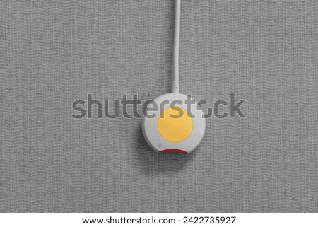 Nurse call button in patient room in modern hospital. Hand pushing nurse call button. patient press red emergency button to calling nurse for help in hospital Royalty-Free Stock Photo #2422735927