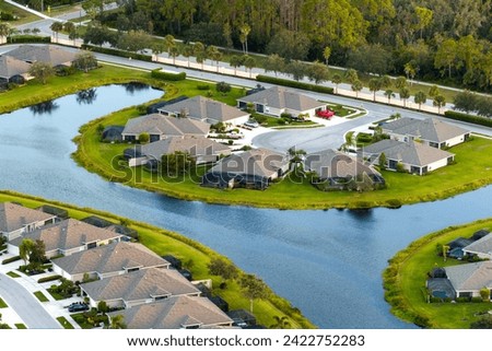 View from above of residential houses in living area in North Port, FL. American dream homes as example of real estate development in US suburbs Royalty-Free Stock Photo #2422752283