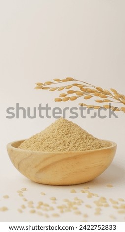 A heaping pile of polished rice bran.In the background are ears of rice and brown rice. Royalty-Free Stock Photo #2422752833