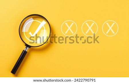 Correct mark focus concept, Magnifying glass focus on correct mark with wrong mark.