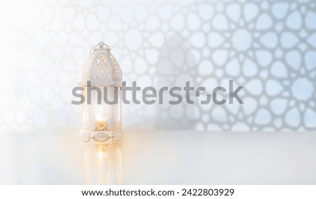 Ramadan Kareem greeting. Islamic lantern near mosque with night sky with crescent moon and stars. End of fasting. Hari Raya card. Eid al-Fitr decoration. Breaking of holy fast day. Muslim holiday. Royalty-Free Stock Photo #2422803929