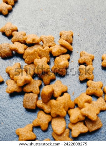 Snack the cat with a crispy mixture of fish and flour