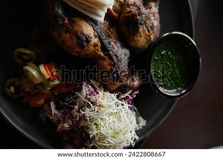 grilled whole chicken with bread sauce and veggies in high resolution images and isolated with blurry ends