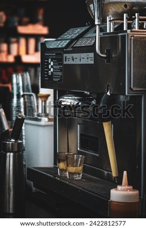 Close up a modern coffee grinder machine. Coffee maker for make espresso, americano, latte, and cappuccino.