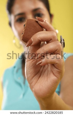 Biscuit showing by a women cute hand 