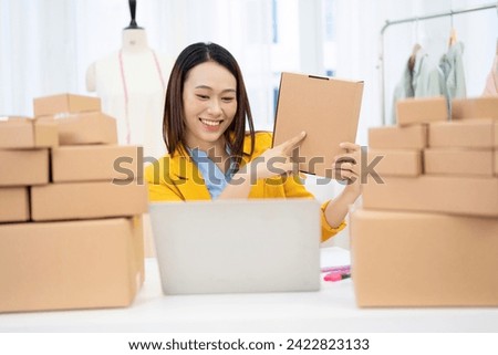 Photo of young Asian woman selling online