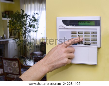 Pushing Alarm. Home security Royalty-Free Stock Photo #242284402