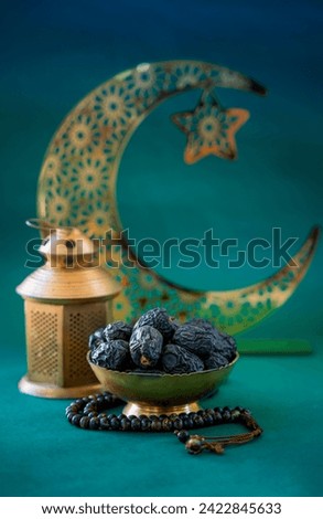 Iftar 2024 image, bowl of dates with lantern lamp and crescent moon shape on the background, Ramadan iftar concept image