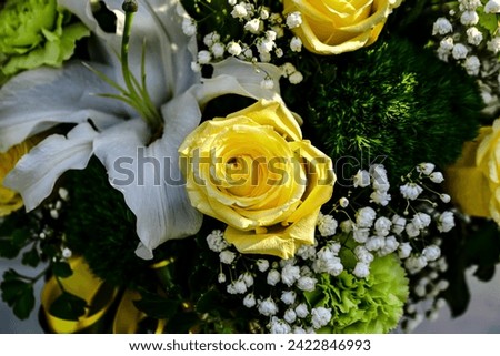 Beautiful flowers bouquet in different color tone and styles in Thailand market, nice background textures. Thai orchids, roses, carnations etc. Close up shot.