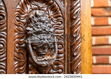 Door knocker at Filoli Garden. Old Door Clapper on Old Wooden Door. 