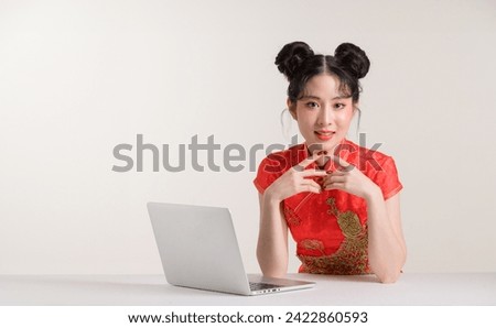 Portrait beautiful young asian woman smile with computer laptop wearing red traditional cheongsam qipao dress isolated on white background