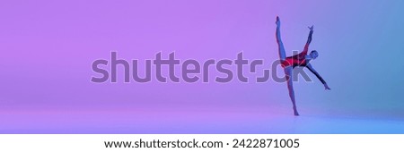 Flexible teen girl in bright costume, rhythmic gymnast dancing against gradient studio background in neon light. Concept of sport, grace, competition, art. Banner. Empty space for text, ad. Event