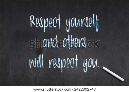 Blackboard with a quote from Confucius saying "Respect yourself and others will respect you.", drawn in the middle.