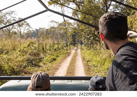 Group of people enjoying the views from the track in a safari tour