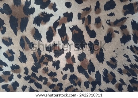 Feel the wild beauty of nature with this fabric print featuring a stylish cheetah design. Its sleek spots evoke grace and power, adding exotic allure to any space or outfit.