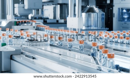 Advanced Bright Modern Pharmaceutical Factory. Medical Ampoule Production Line. Rows of Glass Vials with Orange Caps on Conveyor Belt. Vaccine Production Facility. Medication Manufacturing Process. 