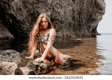 Woman travel sea. Happy tourist enjoy taking picture outdoors for memories. Woman traveler swim in the sea bay with mountains, sharing travel adventure journey