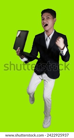 A handsome Asian young man is flying with a green screen