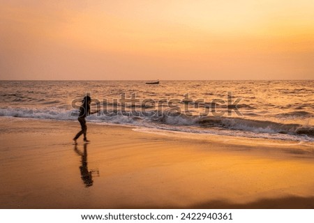 People Enjoying Sunset in Alappuzha Beach (Alleppey beach) In Kerala