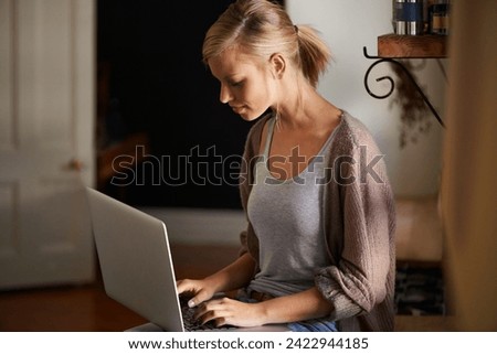 Woman, freelancer and laptop for networking, remote work and internet connection in kitchen for info. Female person, editor and website for research or online news, blog and typing an article on tech