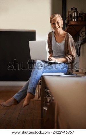 Woman in kitchen, laptop and remote work, smile in portrait and writer for blog, freelancer and copywriting. Working from home, website development and writing article, editor or journalist with tech
