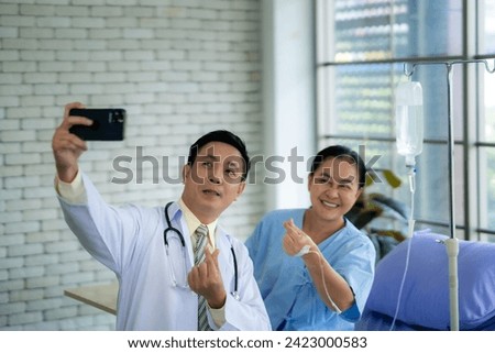 Doctor and patient take pictures together After hearing good news about his injury getting better.