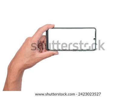 Men's hand holding a blank smartphone display in one hand. game playing. Take a photography. website searching online shopping and entertainment.