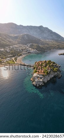 Drone photo of lovely Sveti Stefan in Montenegro coast, Sunset at Sveti Stefan, Crna Gora, Royalty-Free Stock Photo #2423028657