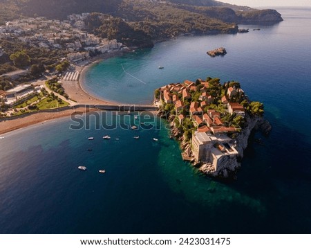 Drone photo of lovely Sveti Stefan island in Adriatic Sea, Montenegro coast, Sunrise at Sveti Stefan, Crna Gora Royalty-Free Stock Photo #2423031475