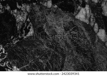 Black white rock texture. Dark black stone marble background for design. Rough cracked mountain surface.