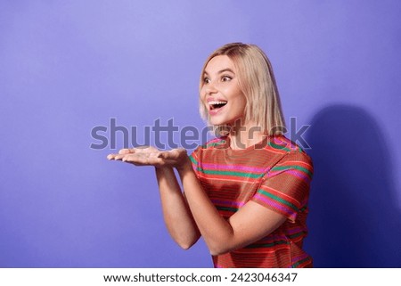 Photo of shocked young funny lady wear striped red t shirt hold two palms introducing innovation isolated on violet color background