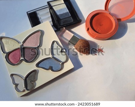 All make-ups have butterfly ,
eyeshadow , black eyeshadow and the red 
blush  photo together in white blackground
