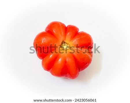 Banyuwangi tomato with beautiful shape like flower in fresh orange color in white background.