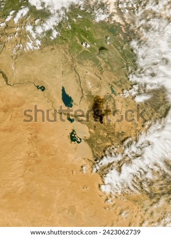 Oil fires in Iraq. Oil fires in Iraq. Elements of this image furnished by NASA.