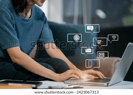 Social media and Marketing virtual icons screen of woman typing keyboard with laptop computer at office at morning light.