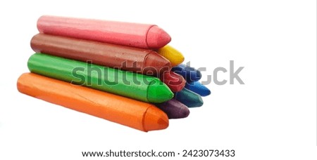 Crayon background. Crayons isolated in white backgrond. Pile of crayons over white background. Yellow, blue, and red crayon isolated on white background. Crayon arranged one over the other. Crayon.