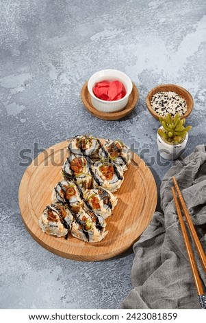 Vegetable Vegan Roll in Fried Onion with Balsamic Sauce; Tempura Roll with Salmon Tartare Topping.
