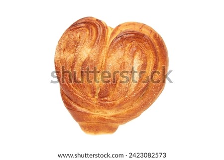 Heart shaped bun with sugar on a white background, isolated. The view from top