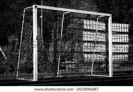 Football goal in the park on the sports field. Outdoor field. Black and white photo