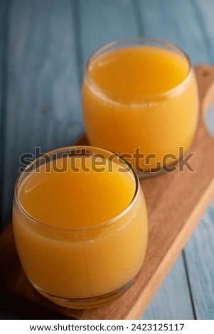 photo orange juice in a drinking glass, antioxidant