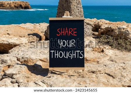 Share your thoughts symbol. Concept words Share your thoughts on beautiful black chalk blackboard. Beautiful red stone blue sea sky background. Business share your thoughts concept. Copy space.