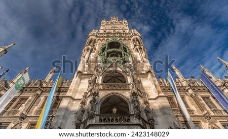 Clock Tower or Glockenspiel close-up, section of bell play timelapse, Munich, Germany. Looking up perspective. Detail of Rathaus New Town Hall with chime in city center. Located on Marienplatz square Royalty-Free Stock Photo #2423148029