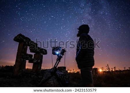 Astrophotographer with milkyway under the sky Royalty-Free Stock Photo #2423153579