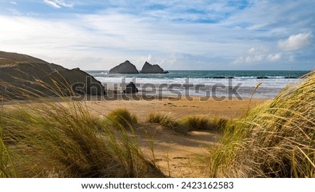 View of Holywell beach from the dunes Royalty-Free Stock Photo #2423162583
