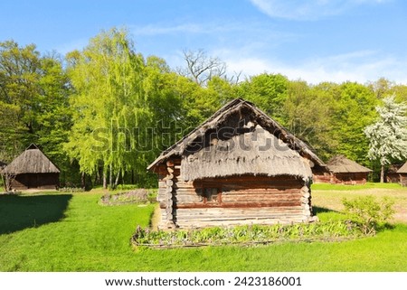 Traditional Ukrainian houses from Polissya Region in Pirogovo, Ukraine Royalty-Free Stock Photo #2423186001